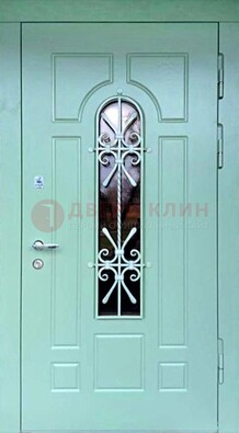 Светло-зеленая железная дверь со стеклом и ковкой ДСК-195 в Можайске